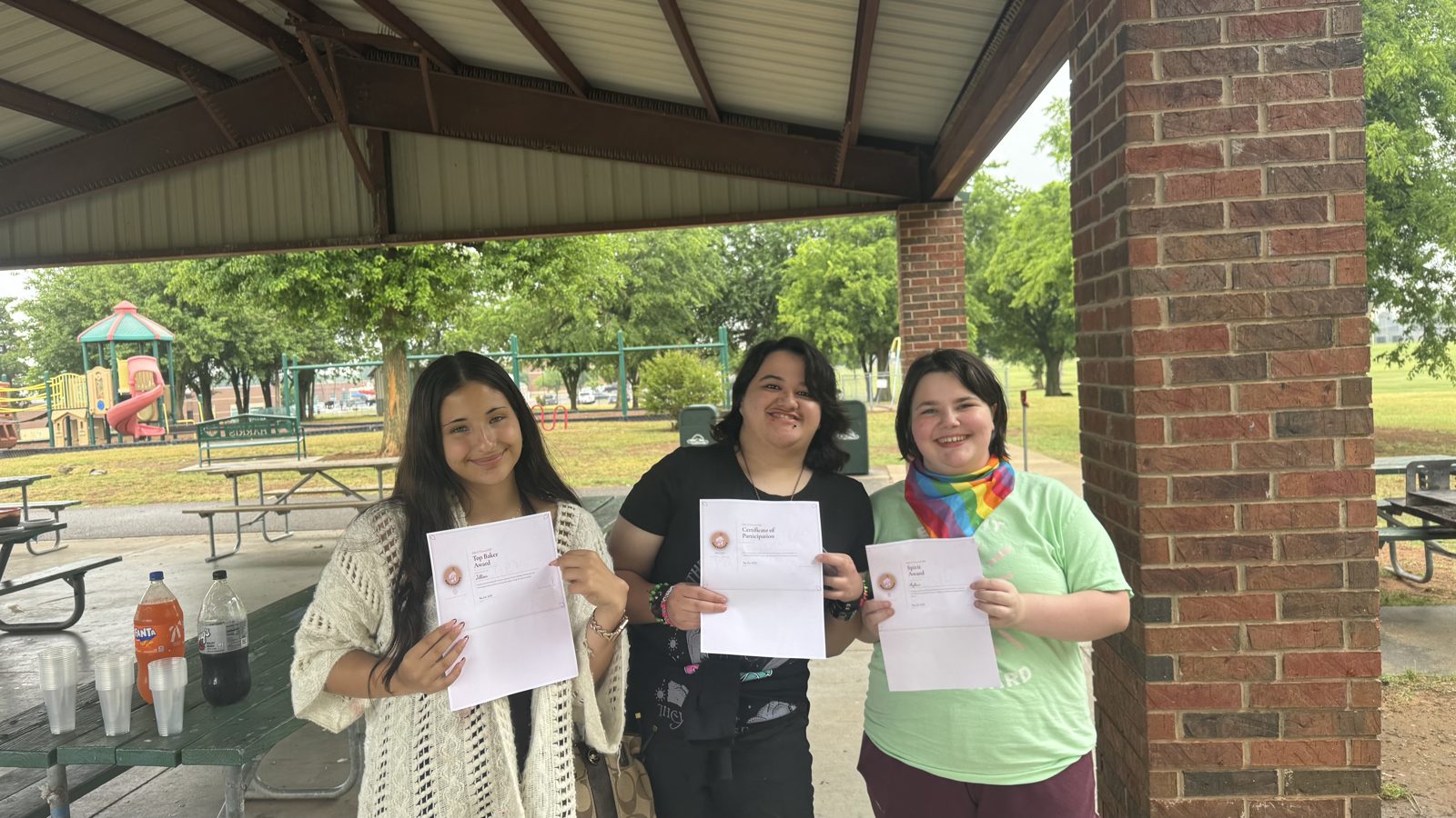 BIF volunteers holding their award certificates at the community banquet
